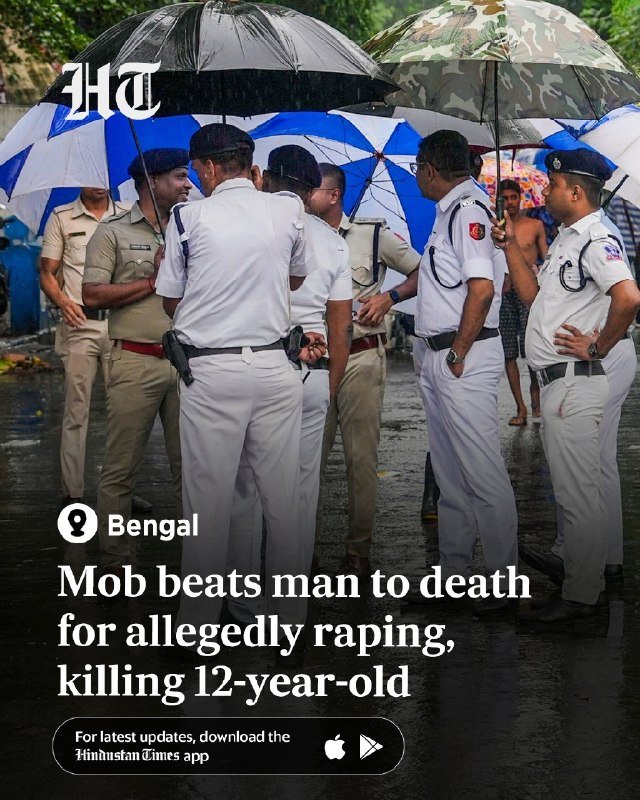 Police officers in uniform stand together under umbrellas in the rain, with on-screen text reading "Bengal: Mob beats man to death for allegedly raping, killing 12-year-old."