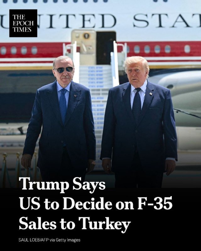 Two men in suits stand side by side in front of an aircraft with "UNITED STATES" lettering, beneath the headline "Trump Says US to Decide on F-35 Sales to Turkey."