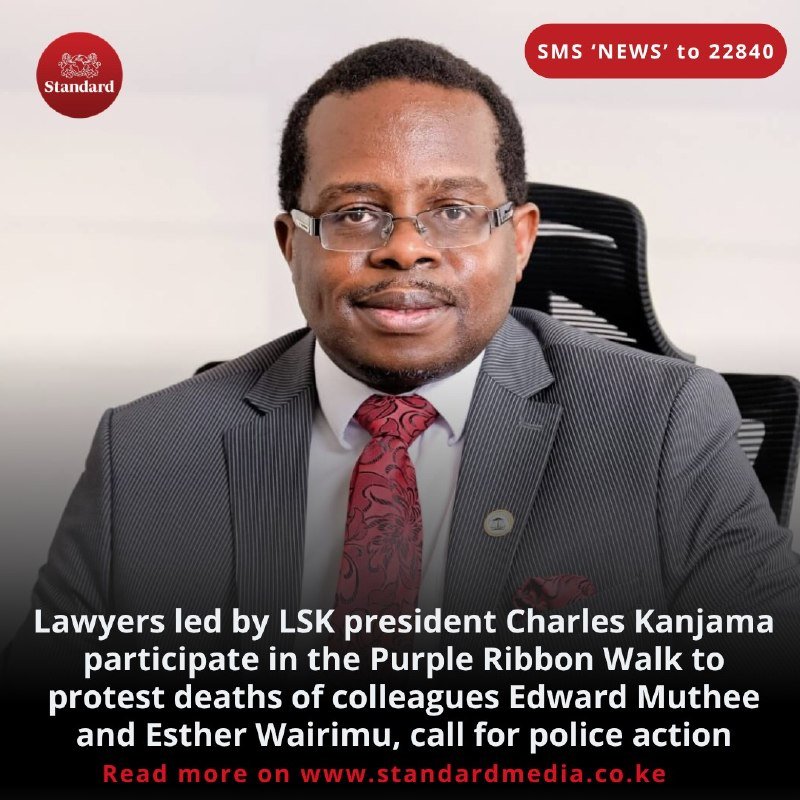 A man in a grey pinstripe suit, glasses, and patterned red tie sits in a black office chair, shown in a portrait graphic with "Standard" and "SMS 'NEWS' to 22840" branding above a caption about lawyers protesting colleagues' deaths.