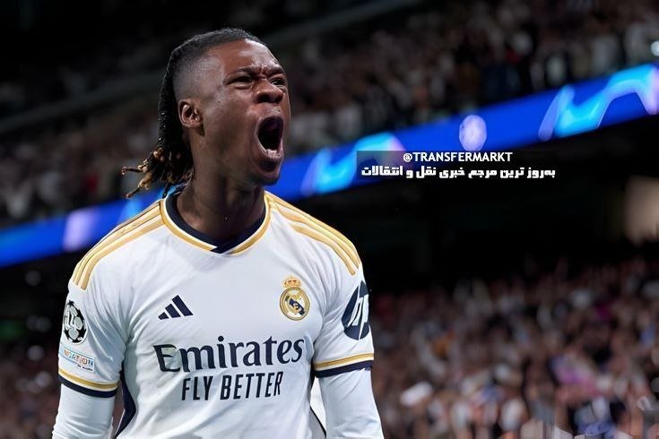 A soccer player in a white Real Madrid jersey with the "Emirates Fly Better" sponsor and a Champions League badge shouts with his mouth open, set against a blurred stadium crowd.