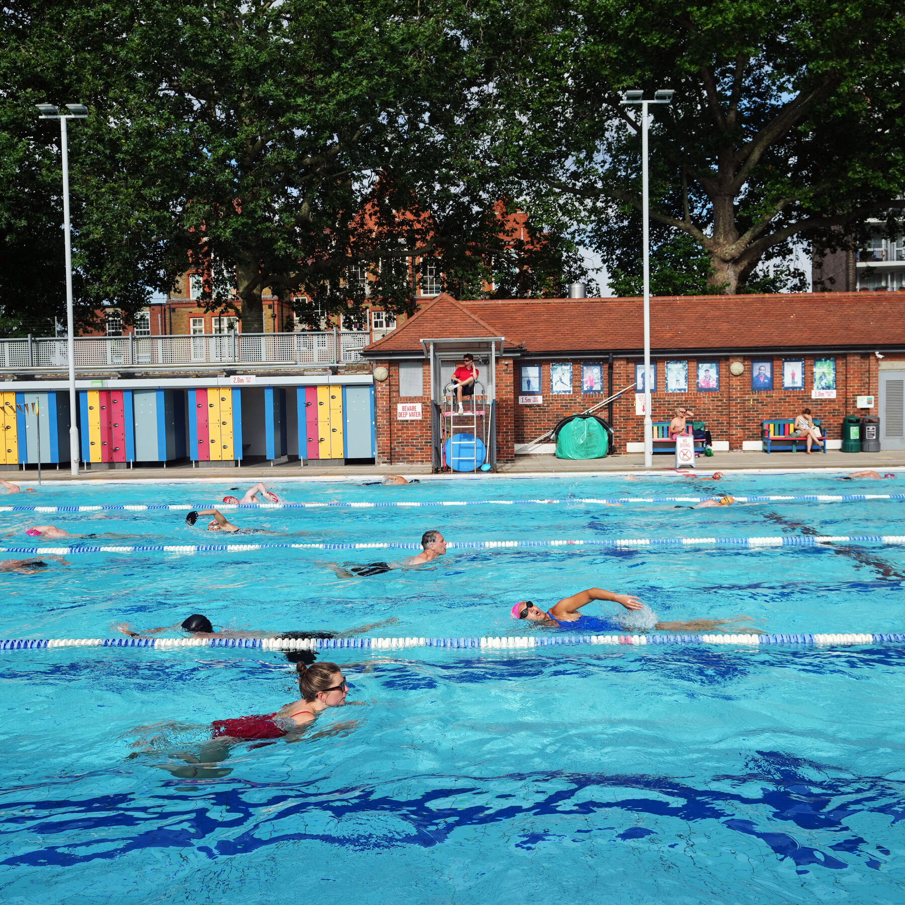 Swimmers cooling off in one of central London's outdoor venues, where summer demand has begun to outstrip available capacity.