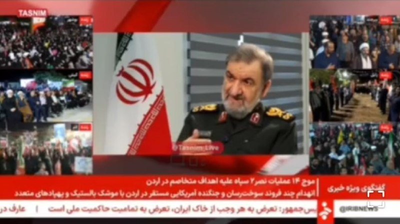 A bearded military official speaks at a podium beside an Iranian flag in a broadcast labeled "TASNIM" and "Tasnimn LIVE," with smaller crowd scenes displayed around the screen.