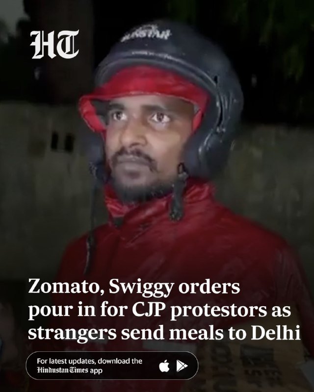 A man wearing a red protective helmet and red jacket looks forward at night, with the Hindustan Times logo and overlay text reading "Zomato, Swiggy orders pour in for CJP protestors as strangers send meals to Delhi."