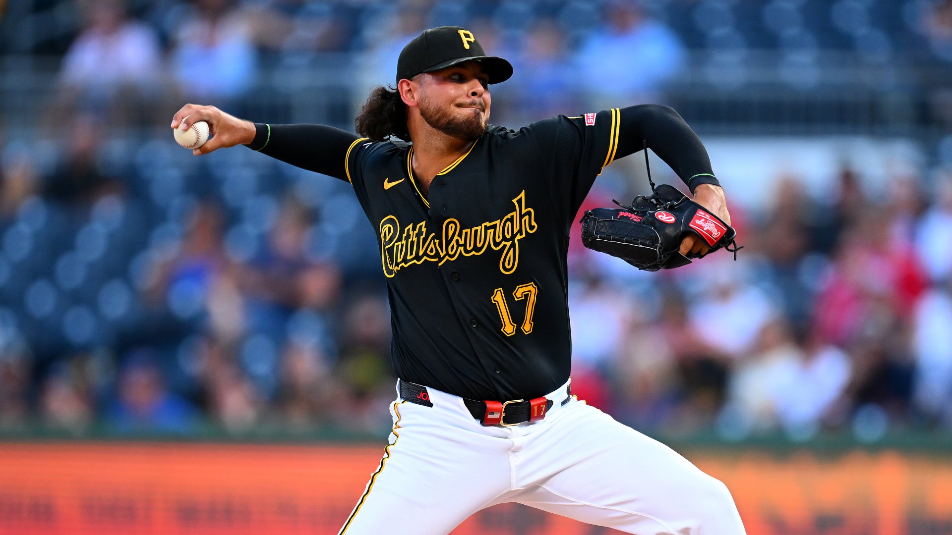 A Pittsburgh Pirates pitcher wearing jersey number 17 throws a pitch during a Major League Baseball game in front of a crowd.